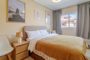 a bedroom with a bed and a window at Casa Limón in Puerto Marino +16 photos