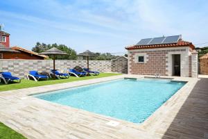 a swimming pool in the backyard of a house at Casa Torre De Meca 2 Shared Pool in Los Caños de Meca