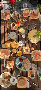 a table with many plates of food on it at Waldmomente in Schauren