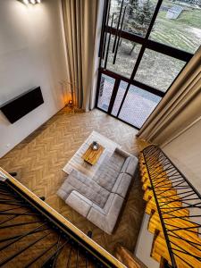an overhead view of a living room with a table at Amber loft 12 Rusnė in Rusnė