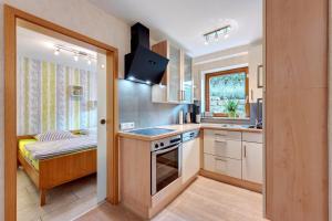 a kitchen with a sink and a stove top oven at Fewo im sonnigen Kaiserstuhl in Endingen