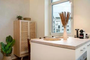 a kitchen with a counter top and a window at Sonnenblick Bregenz in Bregenz +17 photos
