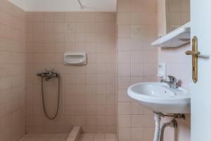 a bathroom with a shower and a sink at Perasma Studios 9 in Kipri