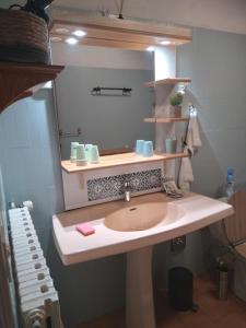 a bathroom with a sink and a mirror at Le Gite Des Peyreyres in Lespéron +42 photos