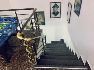 a set of stairs with a hand rail and a stair case at Urban Haven - Orchid, Lekki in Lekki