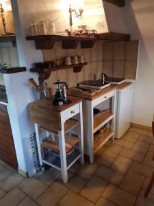 a kitchen with a counter and a sink in it at Casa Piccola in Falmenta
