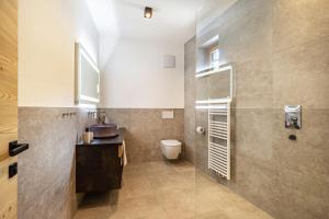 a bathroom with a toilet and a sink at Paflur Lodges Abendrot in Lasa +9 photos