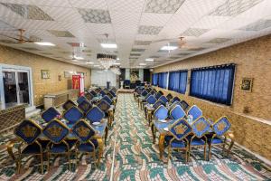 a room filled with blue chairs in a building at Tulsi Garden- Near Prem Mandir Vrindavan in Vrindāvan +107 photos