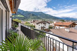 a balcony with a view of the mountains at Penthouse - Apartment Venosta in Naturno