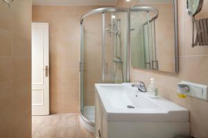 a bathroom with a sink and a shower at Seaviews A61 in Torrox Costa +19 photos