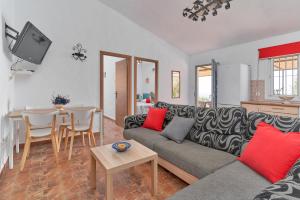 a living room with a couch and a table at Villa Torrox Costa con Piscina in Torrox