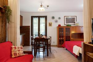 a living room with a table and a dining room at Verger Plein Soleil di Piero in Saint-Pierre