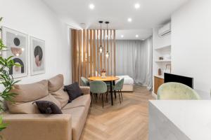 a living room with a couch and a table at Sky Costa Del Sol in Torremolinos