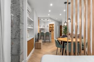 a dining room and kitchen with a table and chairs at Sky Costa Del Sol in Torremolinos