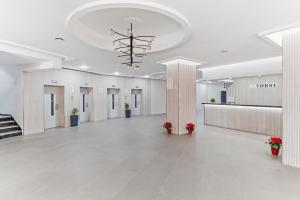 a large hall with a lobby with a chandelier at Sky Costa Del Sol in Torremolinos +13 photos