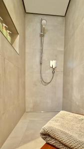 a bathroom with a shower with a bed in it at Kathi´s Allgäuliebe in Weitnau +16 photos