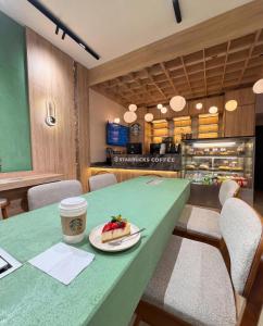 a table with a cup of coffee and a plate of food at Edition Old City Hotel in Istanbul