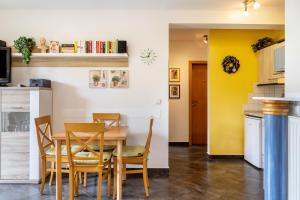 a kitchen and dining room with a table and chairs at Ferienwohnung Tannenblick 6-1 in Oberhof