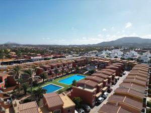 arial view of a resort with a pool and buildings at Casa Angel A 3 in Corralejo