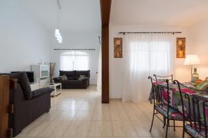 a living room with a couch and a table at Casa Angel A 3 in Corralejo