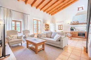 a living room with a couch and a table at Es Lledoner 2 in Islas Baleares