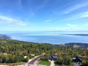 an aerial view of a road and the ocean at O Vitre Spa - Relax with St-Lawrence Views in Les Éboulements