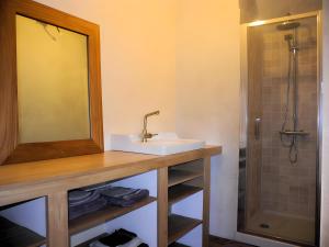 a bathroom with a sink and a shower at Moulin du Tourous - Chambre 1 in Plouédern +12 photos