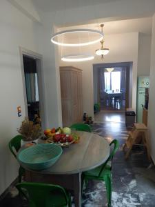 a table with a bowl of fruit on top of it at I have a big dream in Agia Pelagia +12 photos