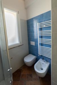 a bathroom with a toilet and a sink at Il Timo in Marciana