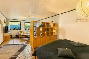 a bedroom with a bed and a desk in a room at Ferienwohnung Stork in Möhnesee