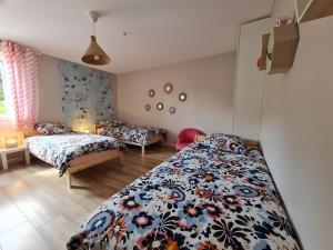 a bedroom with two beds in a room at Villa des ermites in Favières +21 photos