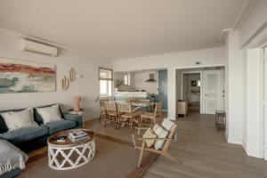 a living room with a couch and a table at Cascais Bay Terrace I in Cascais