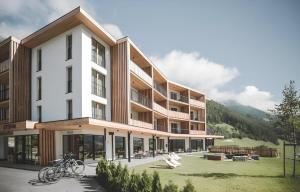 a rendering of a building with a mountain in the background at Stoana Apt 2-2 in San Giacomo