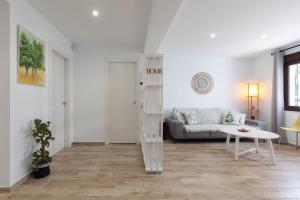 a living room with a couch and a table at Casa La Puente in Mijas