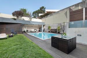 a swimming pool in the backyard of a house at Annex Bedroom - Oporto Garden in Porto