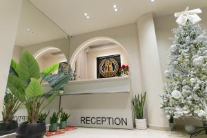 a christmas tree in the lobby of a reception at Hotel Erika in Alexandroupoli