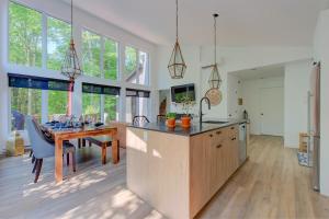a kitchen with a wooden table and a dining room at La Mi-Temps Spa - Relaxation & Private Spa in Pont-Rouge +52 photos