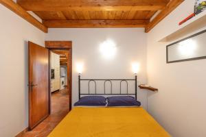 a bedroom with a bed in a room at Il Nazareno - Civetta in Cecina +32 photos