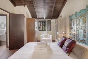 a bedroom with a large bed in a room at El Puente Ronda in Ronda +27 photos