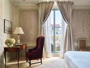 a bedroom with a bed and a desk and a window at Hotel El Palace Barcelona in Barcelona +72 photos