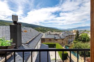 a view of a town from the balcony of a house at Apto Ideal En Osseja in Osséja
