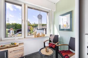 a room with two chairs and a table and a window at Fewo Mama Mia in Menden