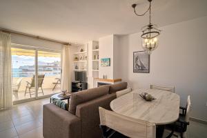a living room with a couch and a table at Costa Bella in Altea