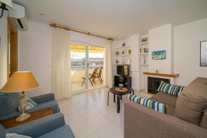 a living room with a couch and a table at Costa Bella in Altea
