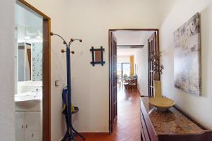 a bathroom with a sink and a mirror at Cabanas Mar 94 in Cabanas de Tavira +12 photos