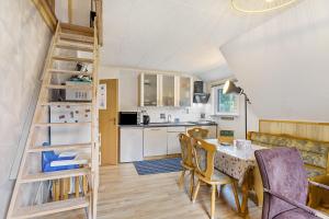 a kitchen and dining room with a table and chairs at Yalet Ferienhaus in Brilon