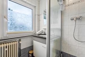 a bathroom with a shower and a sink at Yalet Ferienhaus in Brilon +40 photos