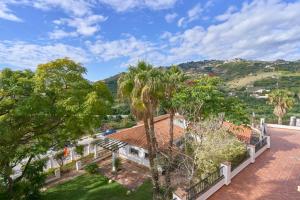 an aerial view of a house with palm trees at Costa Luxe Almuñecar in Almuñécar