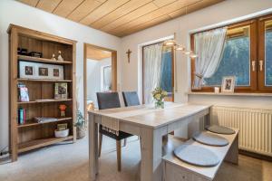 a dining room with a table and two chairs at Jorchenhof in Hofstetten