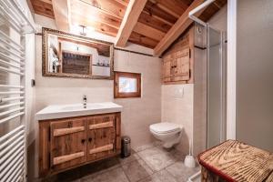 a bathroom with a sink and a toilet at la ferme de la Vora in Châtel +32 photos